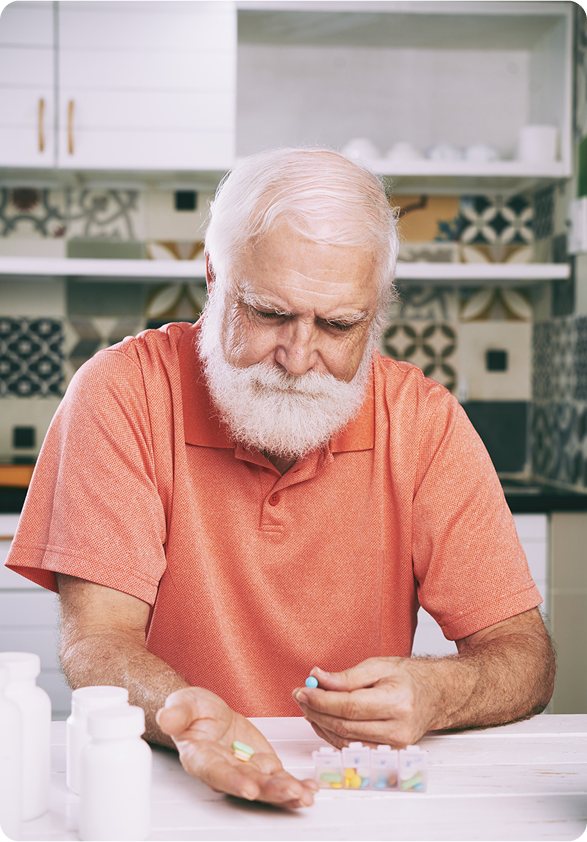 Senior man managing medications